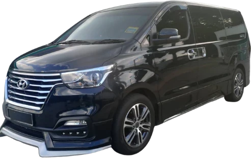 Black Hyundai Starex with bodykit, front three-quarter view