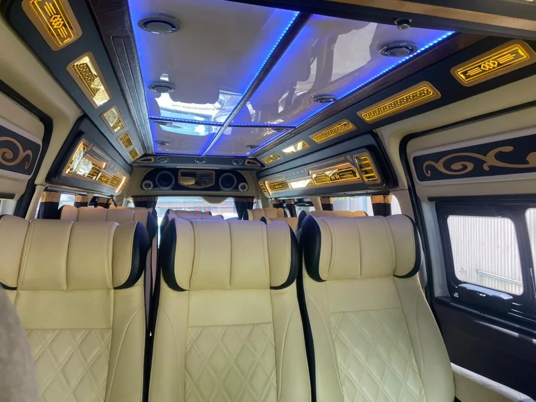 Van cabin with cream leather seats and ambient lighting